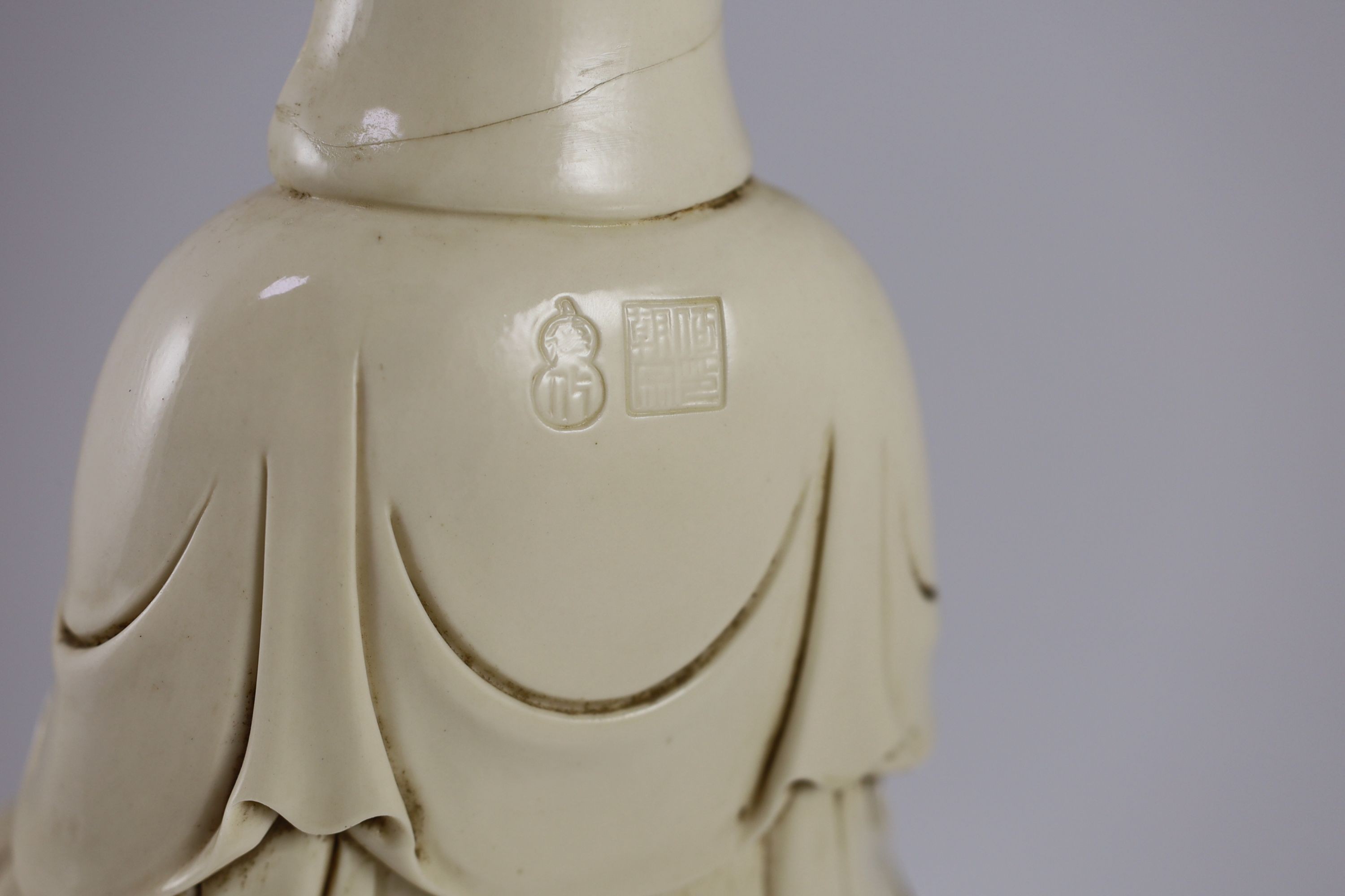 A large Chinese blanc-de-chine figure of Guanyin, Boji Yuren mark, 19th century or later, 36.5 cm high, back of head broken and re-glued